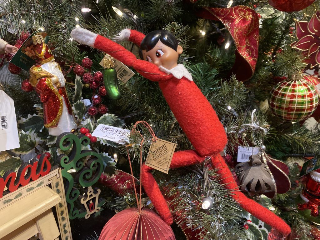 S'more the elf on the shelf demonstrates some decorating magic at The Christmas Shoppe